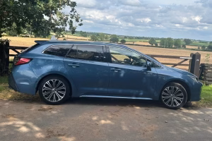 blue toyota car viewd from the side